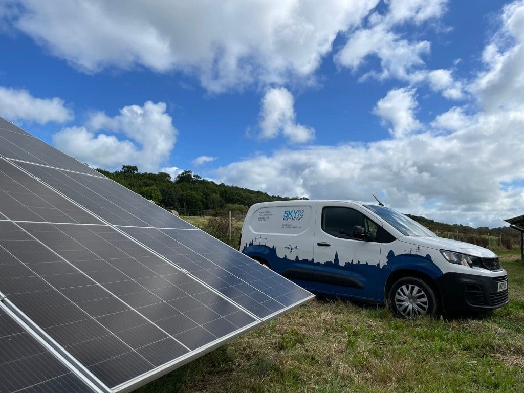 Setting out on solar farm with Sky Revolutions van in background.
