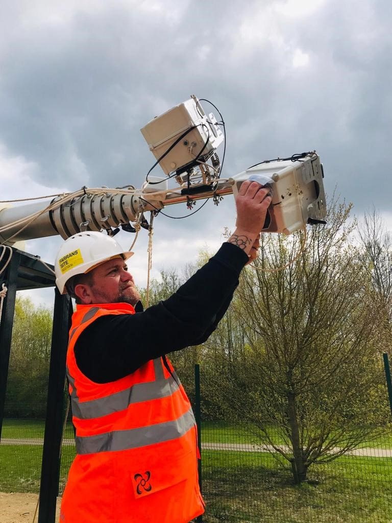Sky Revolutions team member setting up a timelapse camera.