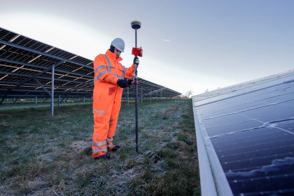 Sky Revolutions team member conducting setting out services on a solar farm.